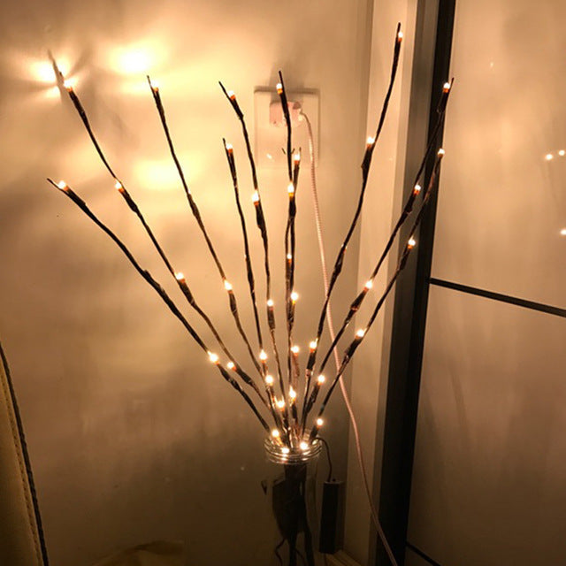 Warm white Christmas LED lights with 20 floral-shaped bulbs on a 30-inch battery-powered string