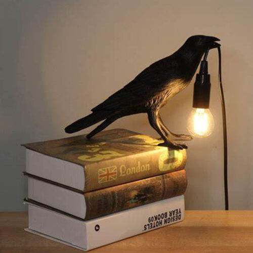 Resin raven desk lamp holding a corded LED bulb – gothic crow table light for home or office decor