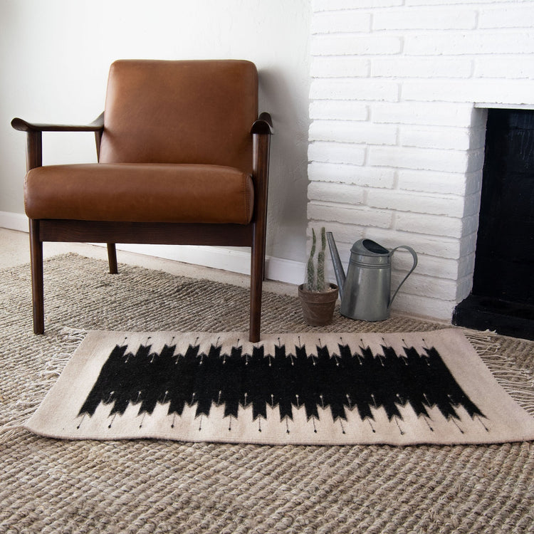 Handmade Southwestern style rug with lightning pattern, crafted on waist loom using 100% wool by artisans from Oaxaca, Mexico.