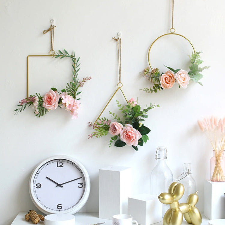 Gold geometric hanging decor made from metal, perfect for modern interiors or event styling with flowers and lights