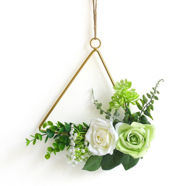 Gold geometric hanging decor made from metal, perfect for modern interiors or event styling with flowers and lights