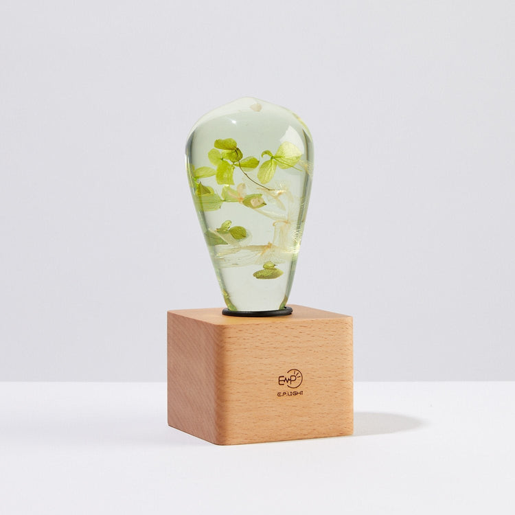 Handmade white hydrangea resin table lamp with wooden base and LED bulb