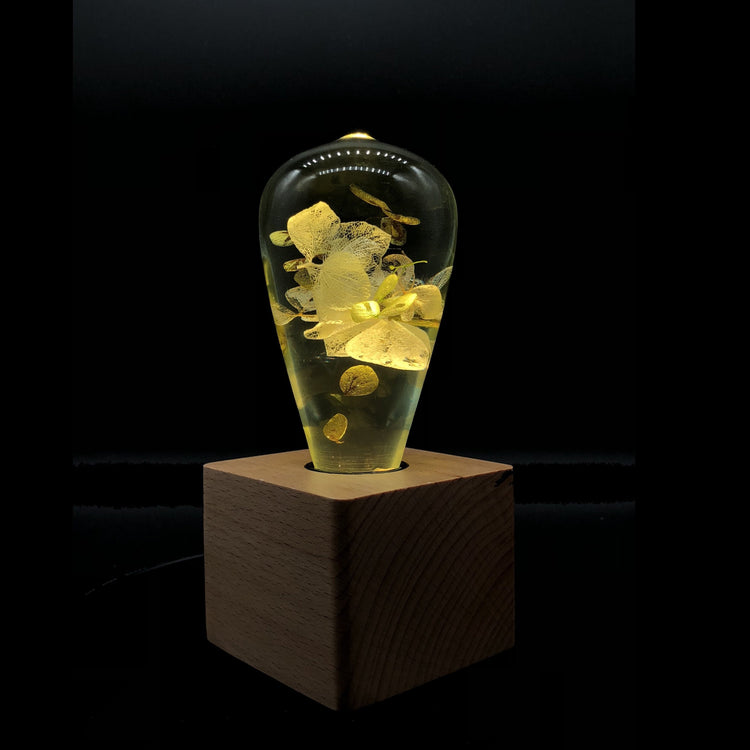 Handmade white hydrangea resin table lamp with wooden base and LED bulb