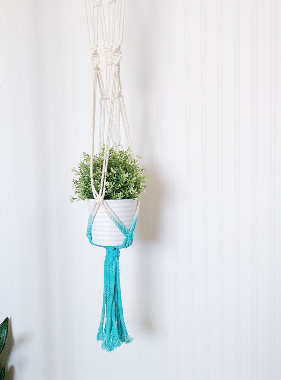 Handmade macrame plant hanger with Aquamarine dip-dye, crafted from cotton rope, ideal for indoor small pots and modern boho home decor.