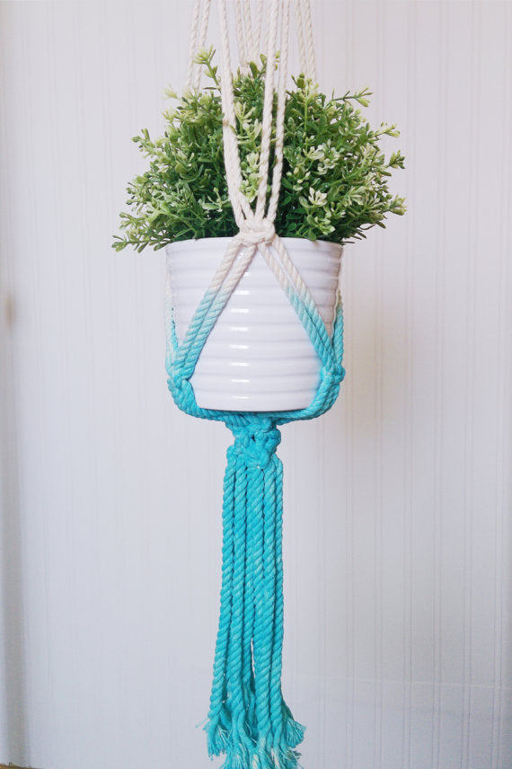 Handmade macrame plant hanger with Aquamarine dip-dye, crafted from cotton rope, ideal for indoor small pots and modern boho home decor.
