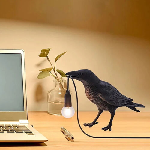 Resin raven desk lamp holding a corded LED bulb – gothic crow table light for home or office decor