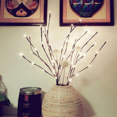 Warm white Christmas LED lights with 20 floral-shaped bulbs on a 30-inch battery-powered string