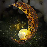 Wrought iron solar lawn light with moon design and warm LED for garden or patio use