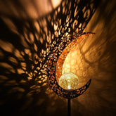 Wrought iron solar lawn light with moon design and warm LED for garden or patio use