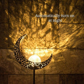 Wrought iron solar lawn light with moon design and warm LED for garden or patio use