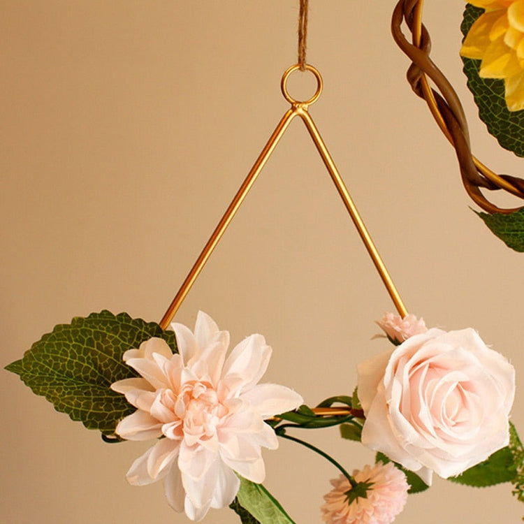 Gold geometric hanging decor made from metal, perfect for modern interiors or event styling with flowers and lights