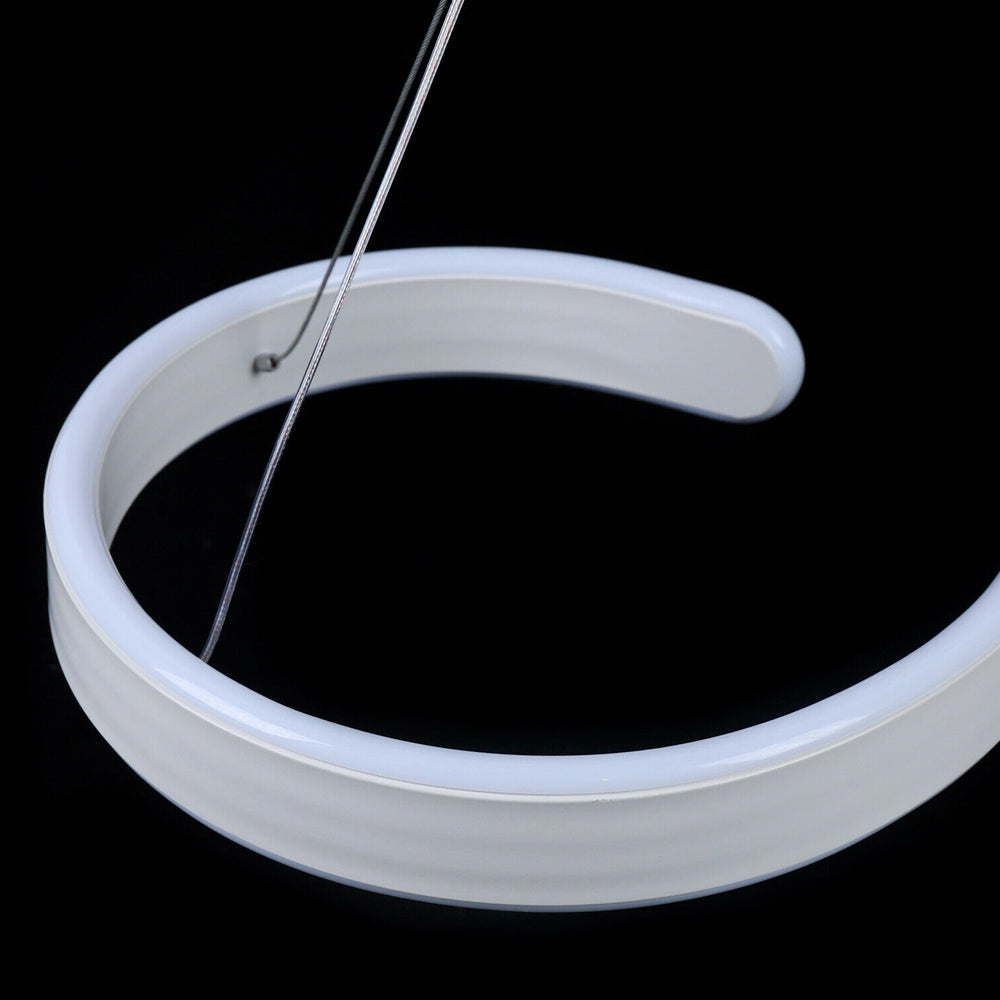 Modern LED ceiling light with swirl-shaped acrylic design and adjustable hanging wire, perfect for living rooms, dining rooms, or modern spaces